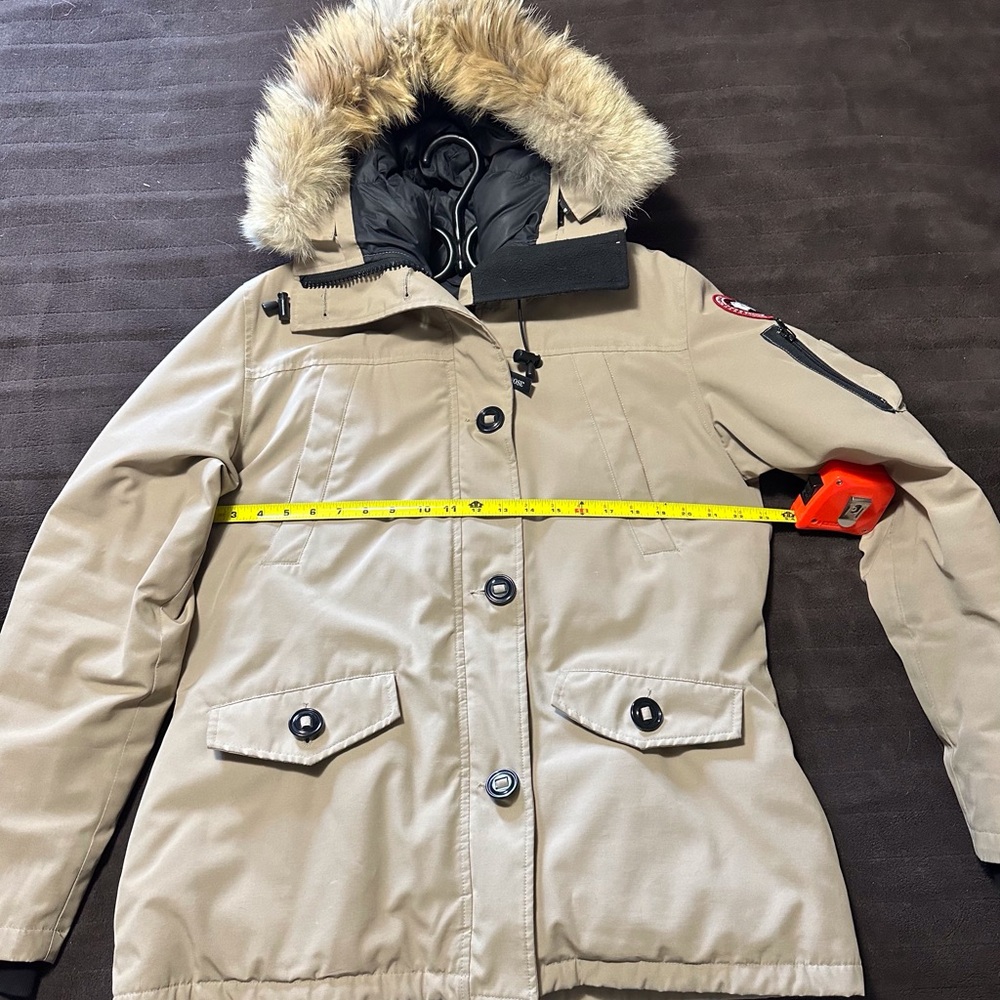 Tan and black Canada Goose Montebello jacket with fur hood trim